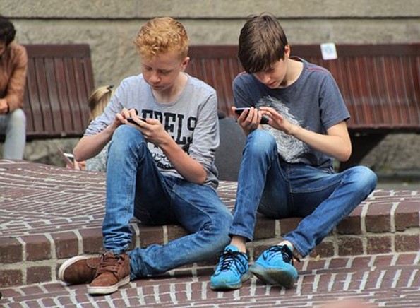 Kids playing on their phones