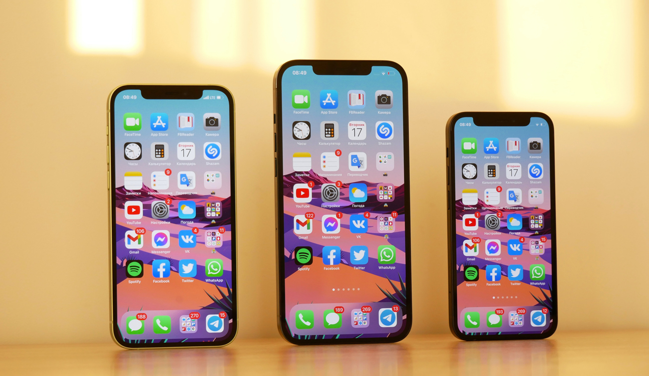 A line-up of three iPhone 12 models