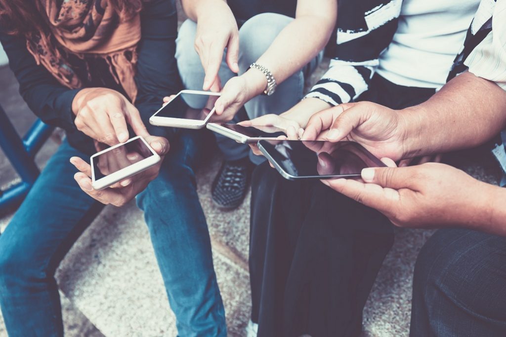 Group of people on smartphones