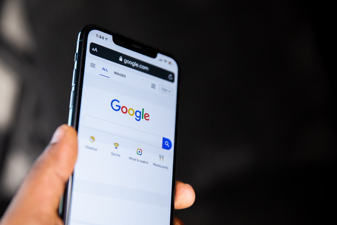 A mobile phone with Google loaded on the screen