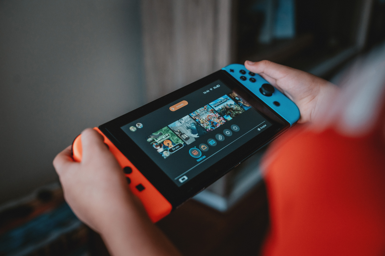 A person playing a game on a Nintendo Switch