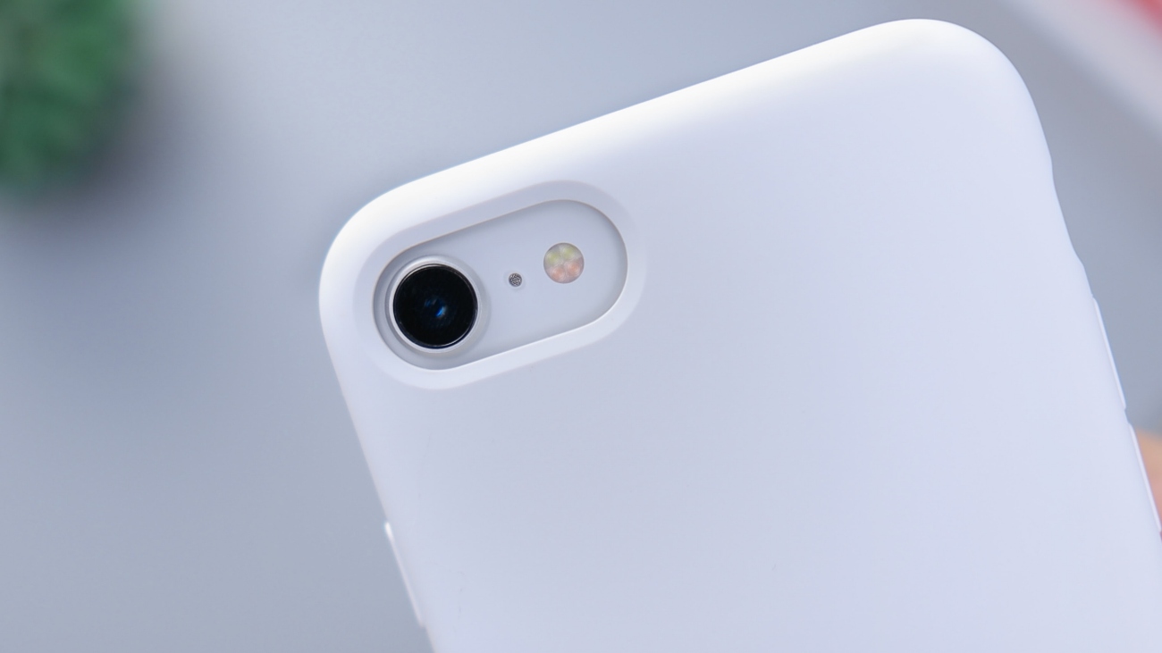iphone se in white case close up on camera