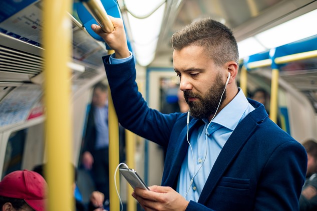 Man on phone on tube
